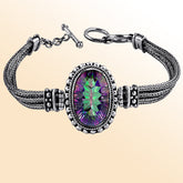 Handmade sterling silver bracelet with radiant oval Mystic Quartz and woven Balinese chain, elegant artisan jewelry for women.